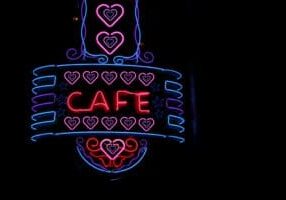 Scenic shot of a vintage neon Cafe sign on a restaurant building