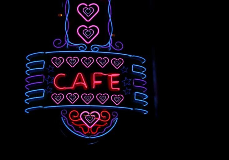 Scenic shot of a vintage neon Cafe sign on a restaurant building